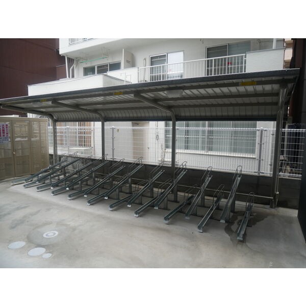 自転車はこちらに置かれて下さい