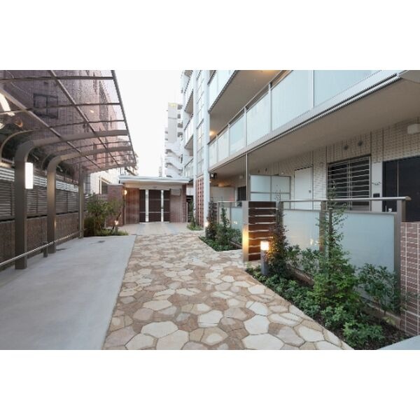 自転車はこちらに置かれて下さい