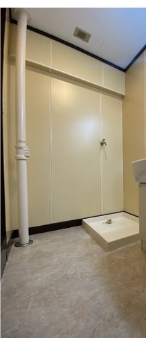 洗濯機はここ。