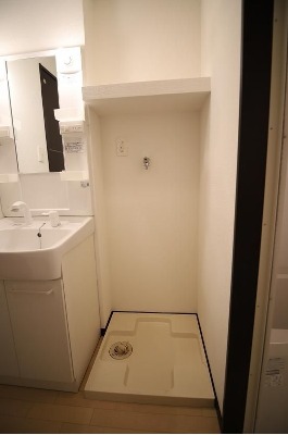 洗濯機はここ。