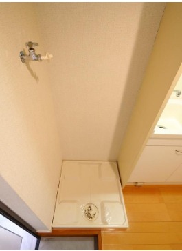 洗濯機はここ。