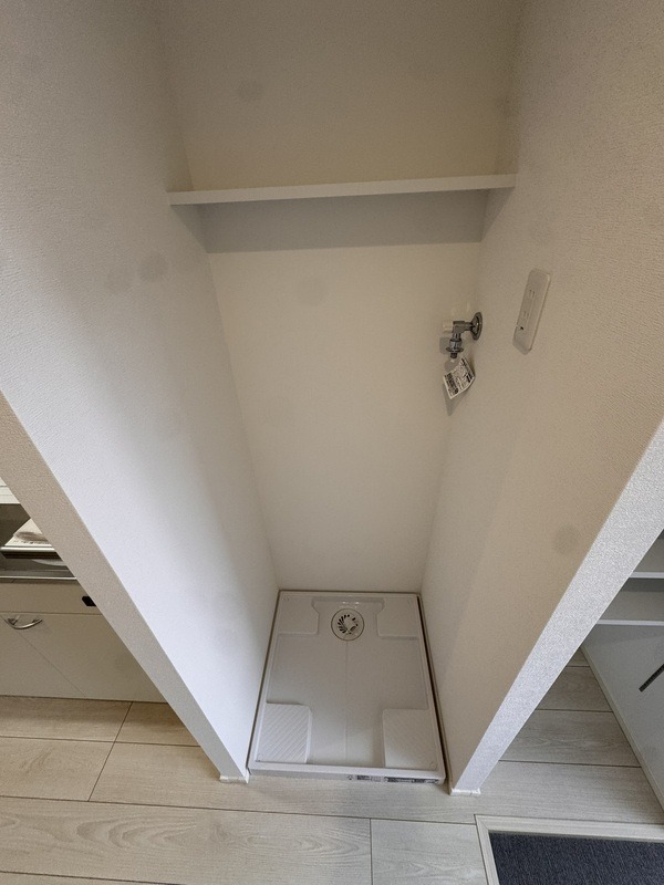 洗濯機はここ。