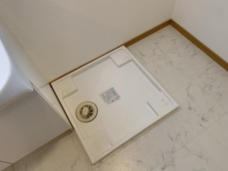 洗濯機はここ。