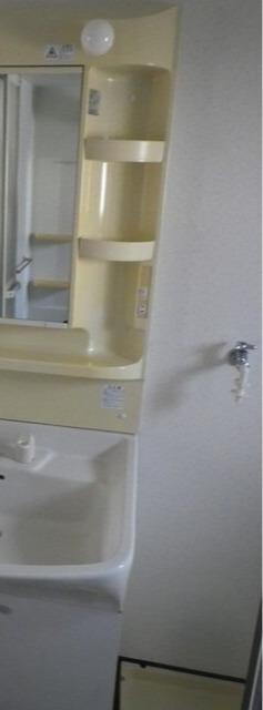 洗濯機はここ。